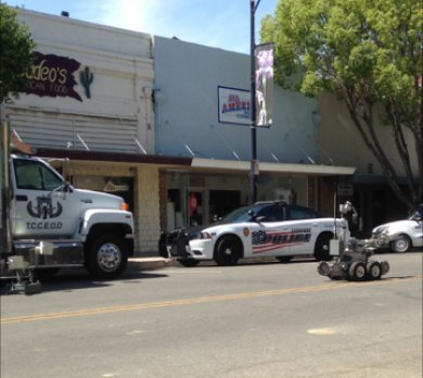 A robotic device can be seen approaching the scene of a suspicious device in downtown Lemoore the morning of May 20.